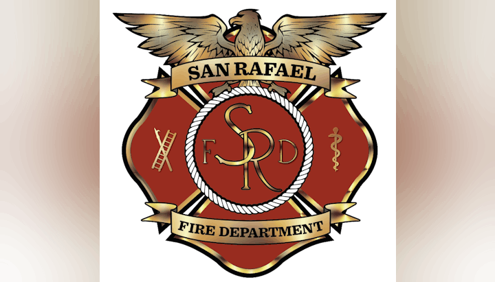 Emblem of San Rafael Fire Department with an eagle, firefighting symbols, and a caduceus.