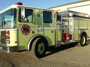 A yellow fire truck parked outside.