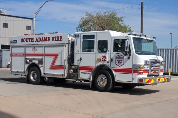 May contain: transportation, truck, vehicle, fire station, fire truck, and person