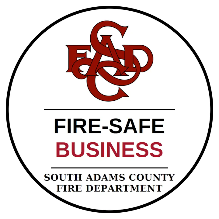The image features a logo for the South Adams County Fire Department, promoting fire safety for businesses.