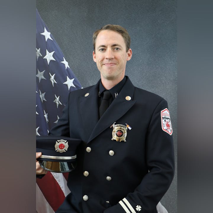 May contain: officer, military uniform, military, person, human, suit, clothing, coat, overcoat, apparel, and symbol