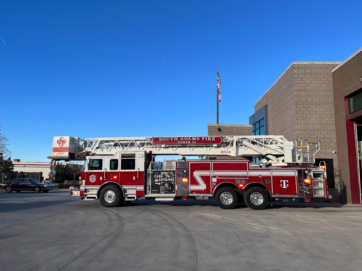 May contain: transportation, vehicle, fire truck, truck, car, fire station, and flag