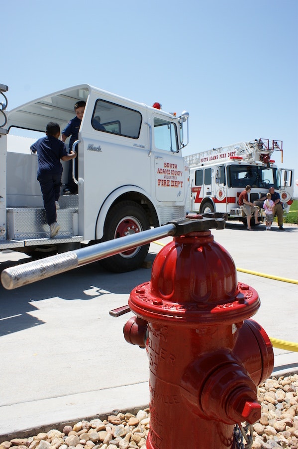May contain: truck, transportation, vehicle, person, human, fire hydrant, hydrant, wheel, machine, and fire truck