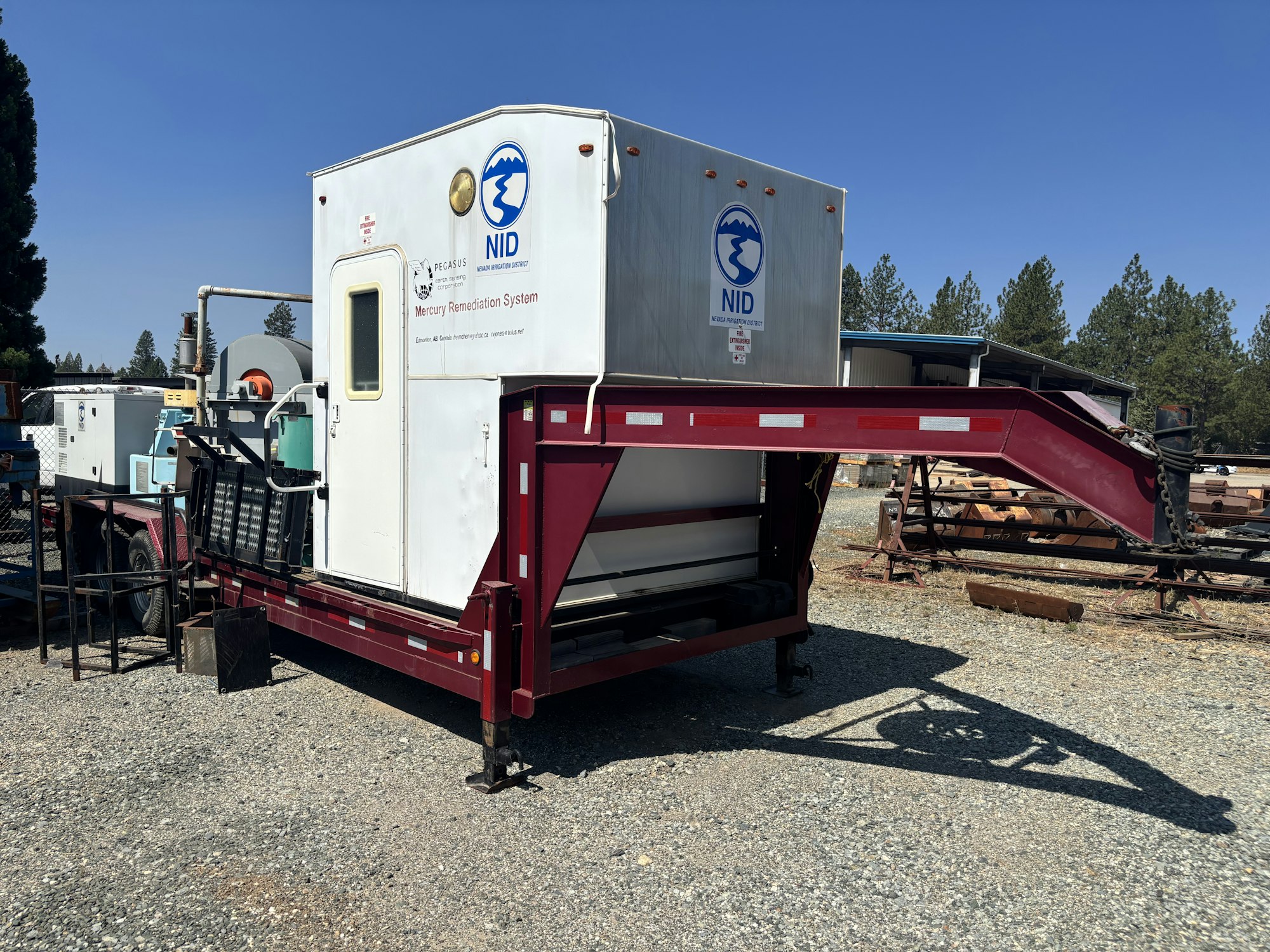 The image shows a mercury remediation system, mounted on a trailer, used for environmental cleanup.