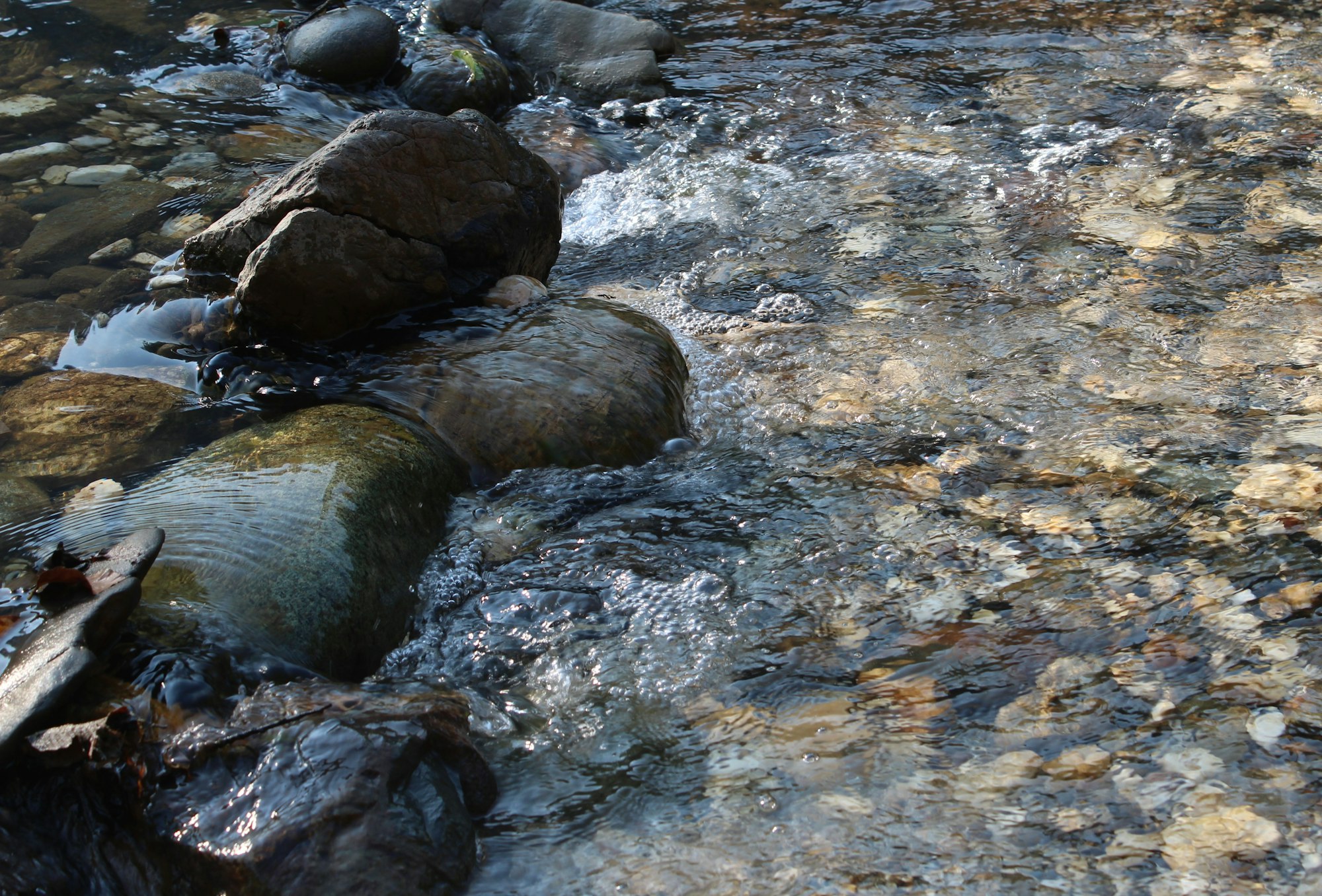 May contain: creek, nature, outdoors, stream, water, slate, and rock