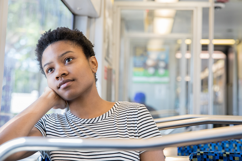May contain: head, person, face, happy, smile, photography, portrait, black hair, hair, and handrail