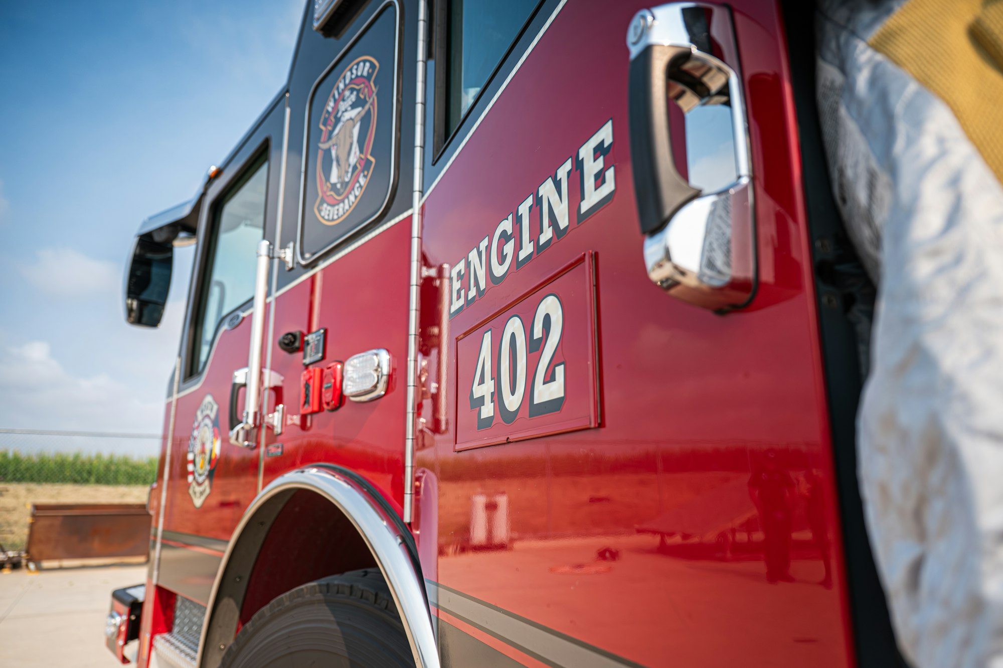 Red fire truck with "ENGINE 402" text and partial logo visible.