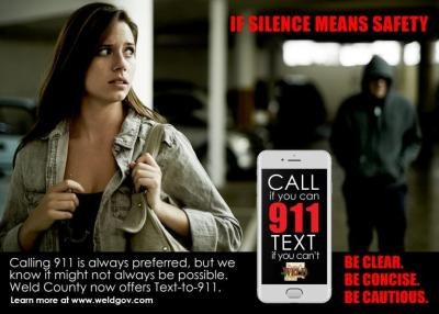 An awareness ad with a woman, a lurking figure, and a phone displaying "Text to 911" emphasizing silent emergency contact.