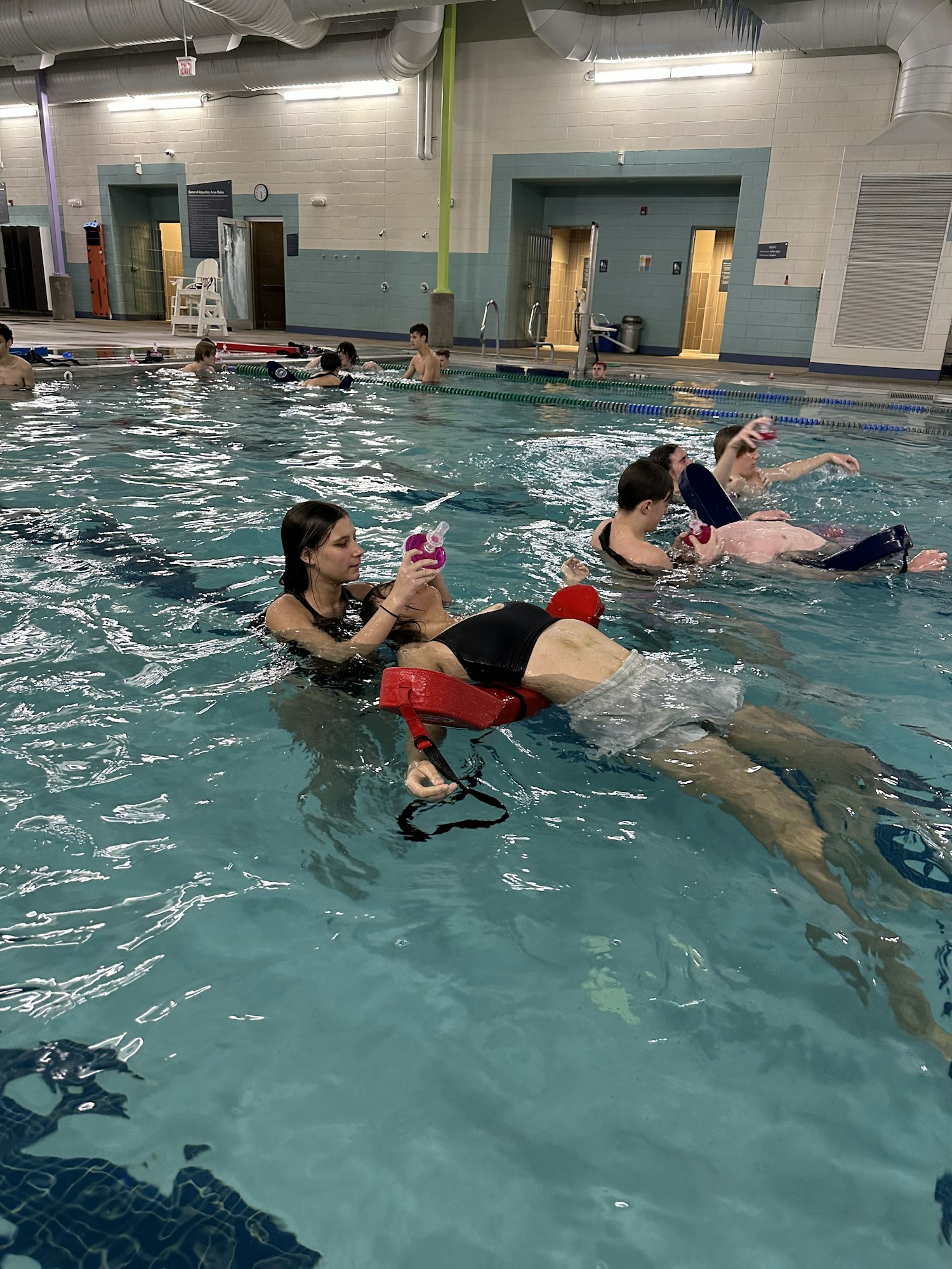 Lifeguards practicing preforming in water ventilations