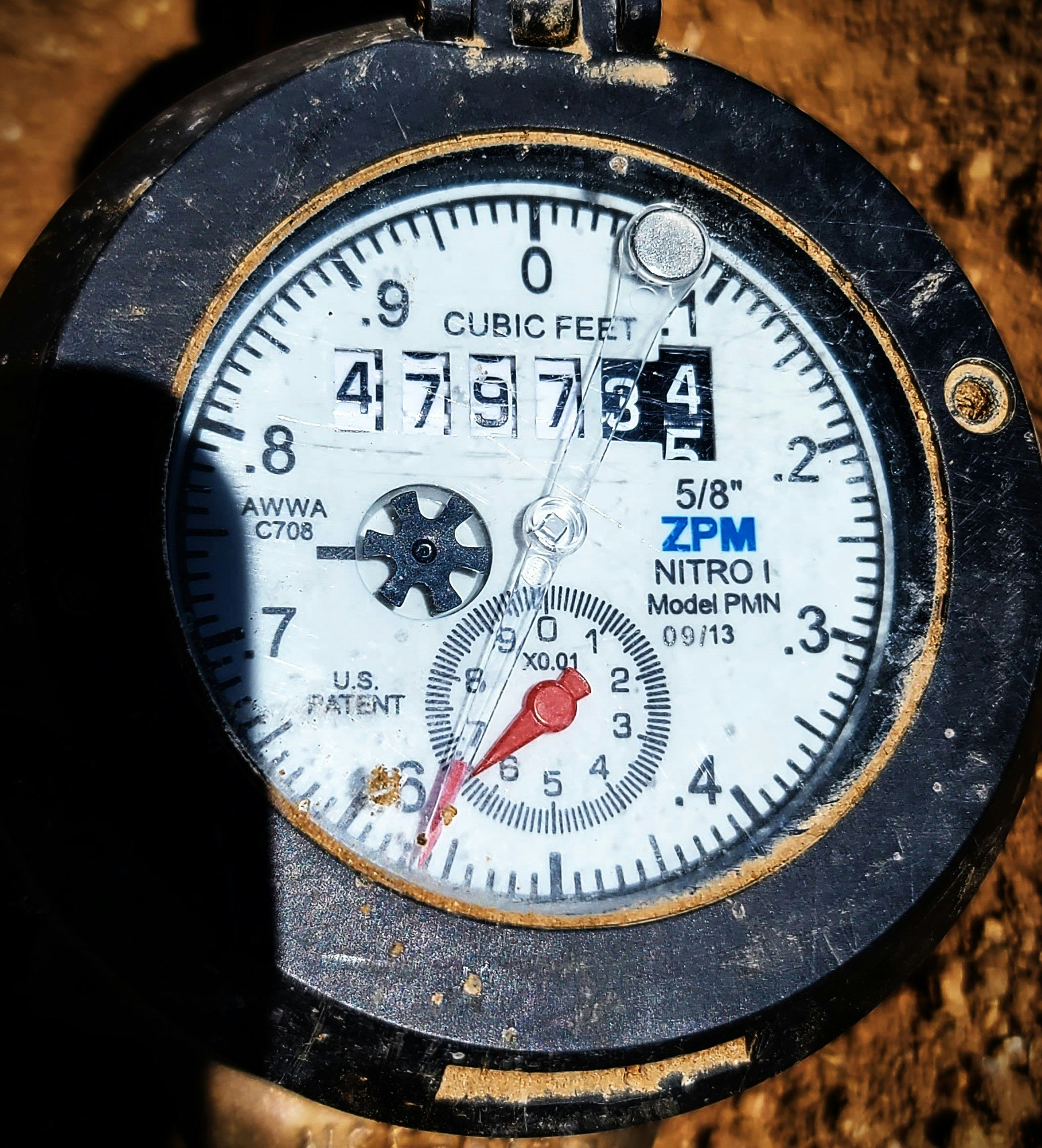 Close-up image a water meter showing cubic feet usage.