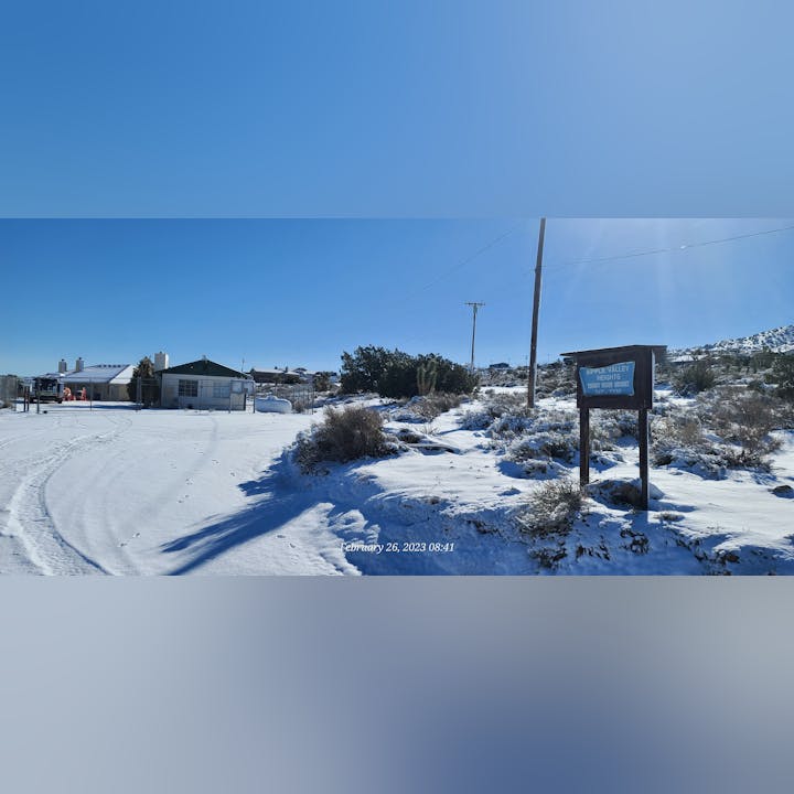 May contain: architecture, building, outdoors, shelter, nature, countryside, hut, rural, neighborhood, scenery, mailbox, utility pole, city, fir, plant, tree, and person
