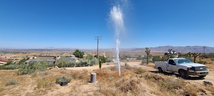 May contain: mountain, nature, outdoors, pickup truck, transportation, truck, vehicle, water, and utility pole