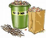 A yard waste bin and paper bag filled with leaves, next to a pile of twigs.