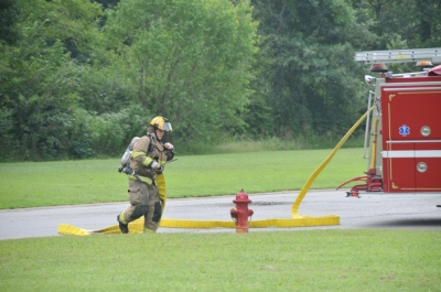 May contain: helmet, clothing, glove, footwear, shoe, person, fire hydrant, and hydrant