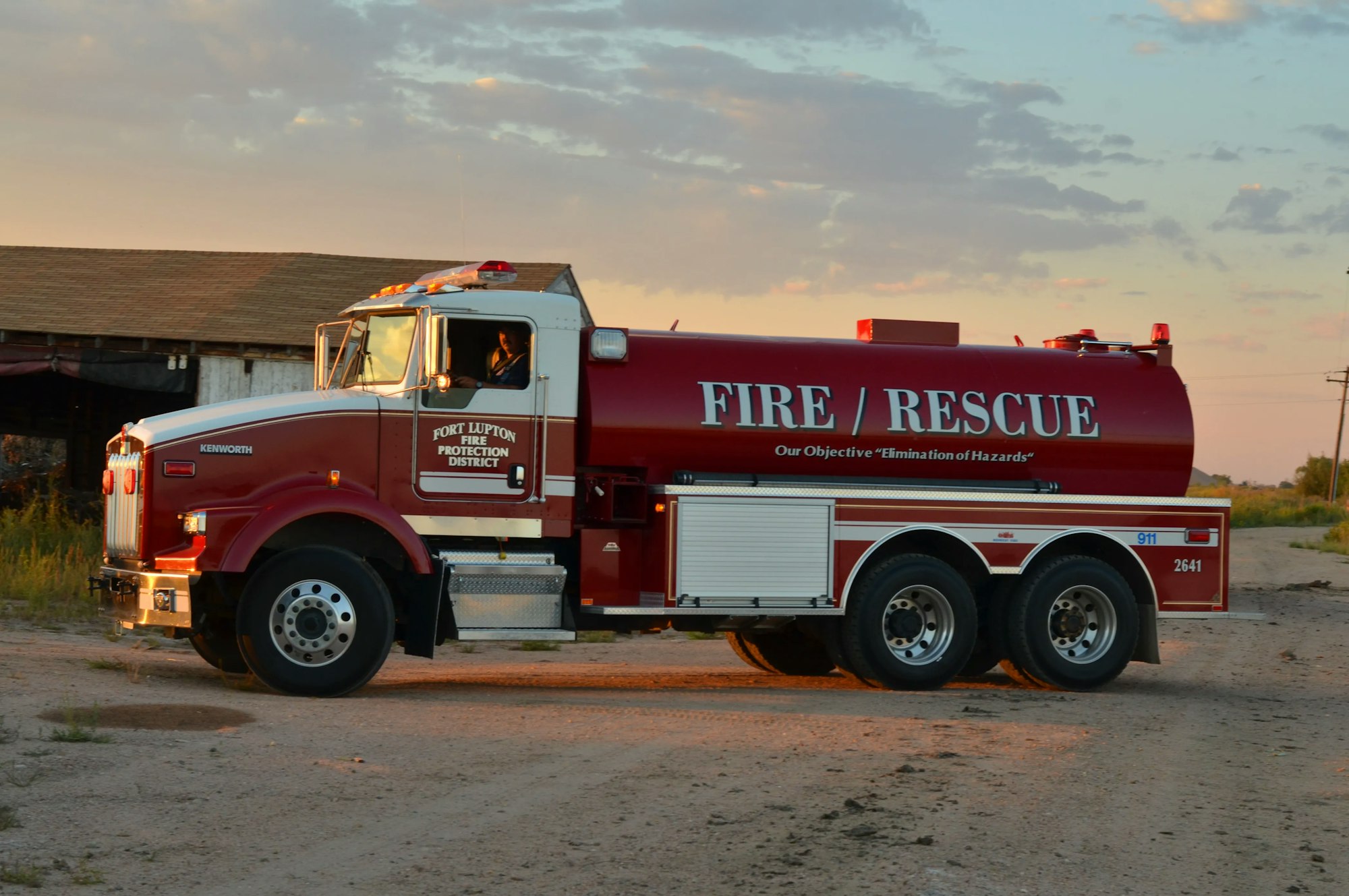 A red fire and rescue truck at dusk.