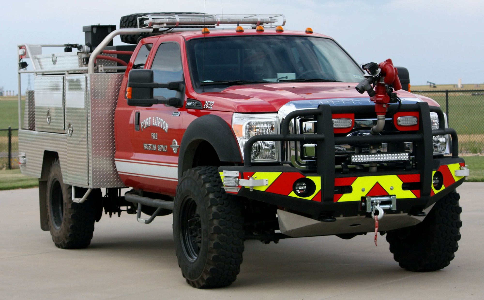 Red fire truck with equipment, marked "Fort Lupton Fire."