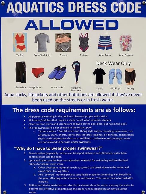 Aquatics dress code sign listing allowed swimwear and rules, including proper swim attire, no street clothes, and hygiene information.