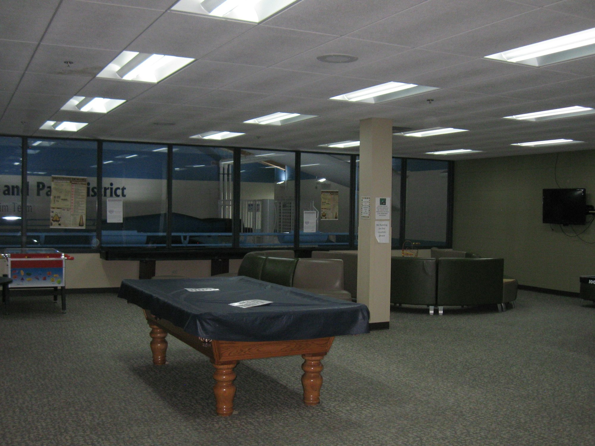 May contain: furniture, table, indoors, desk, computer hardware, electronics, hardware, monitor, screen, billiard room, pool table, and room