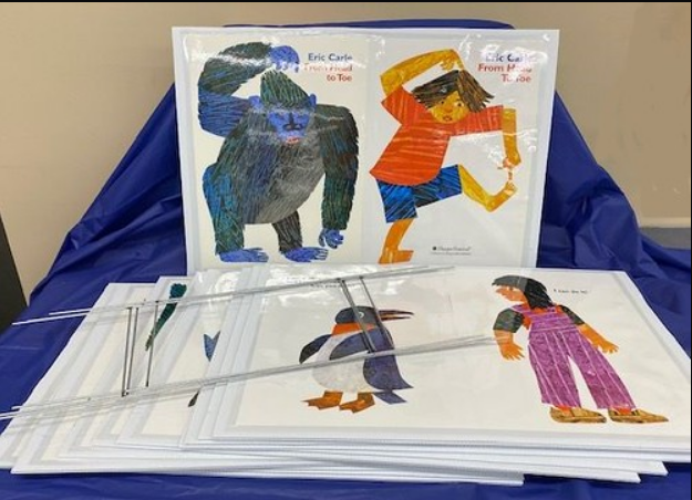 Stack of illustrated books titled "From Head to Toe" by Eric Carle, featuring colorful animal and human drawings.
