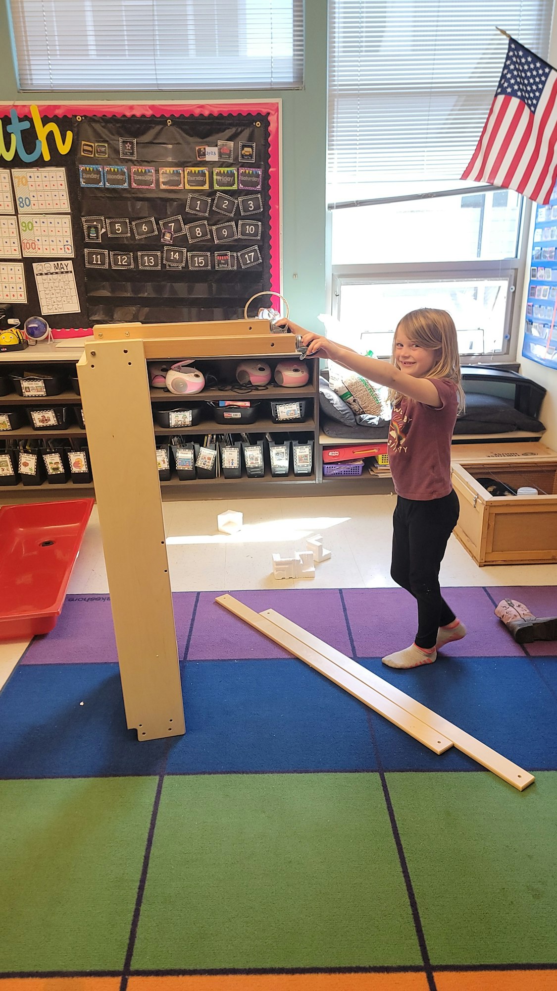 May contain: person, wood, flag, floor, and flooring