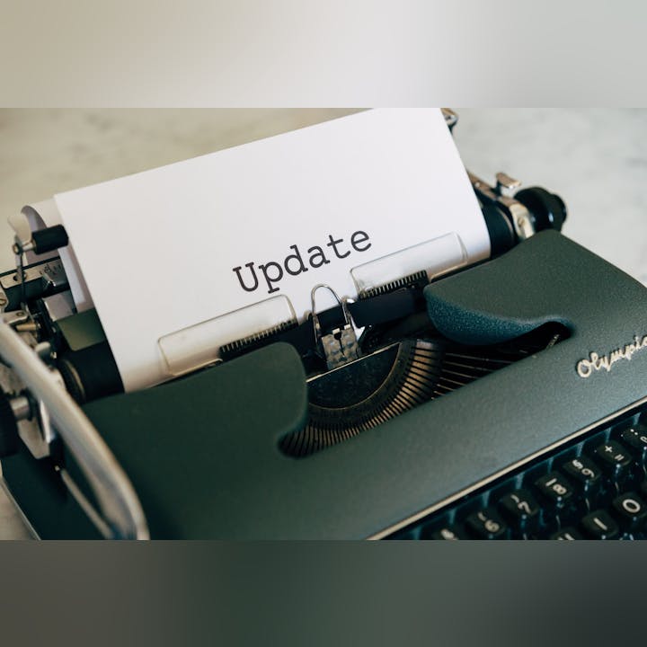 A typewriter with a paper that reads "Update".