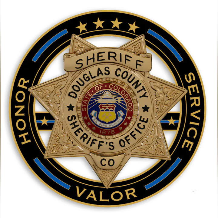 The image is a badge of the Douglas County Sheriff's Office in Colorado, featuring a star design with "Honor," "Service," and "Valor."