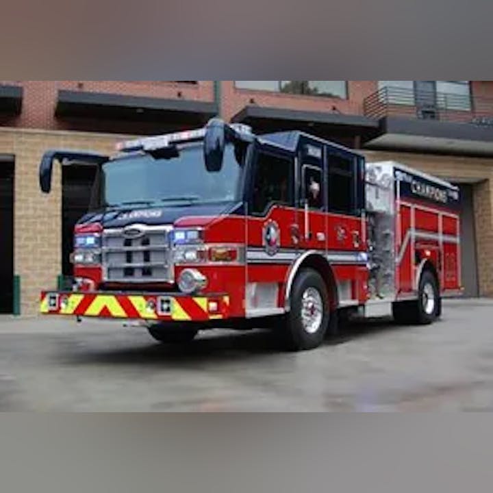 A red fire truck parked outside a building.
