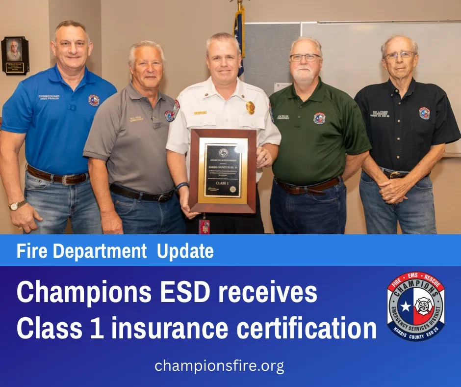Group of men with a certification plaque; text: "Champions ESD receives Class 1 insurance certification."