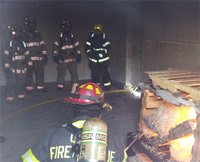 May contain: person, human, fireman, helmet, clothing, and apparel