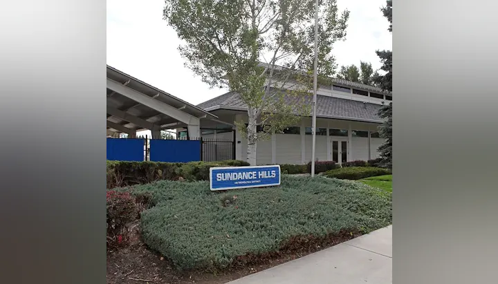 Sundance Hills building with some bushes