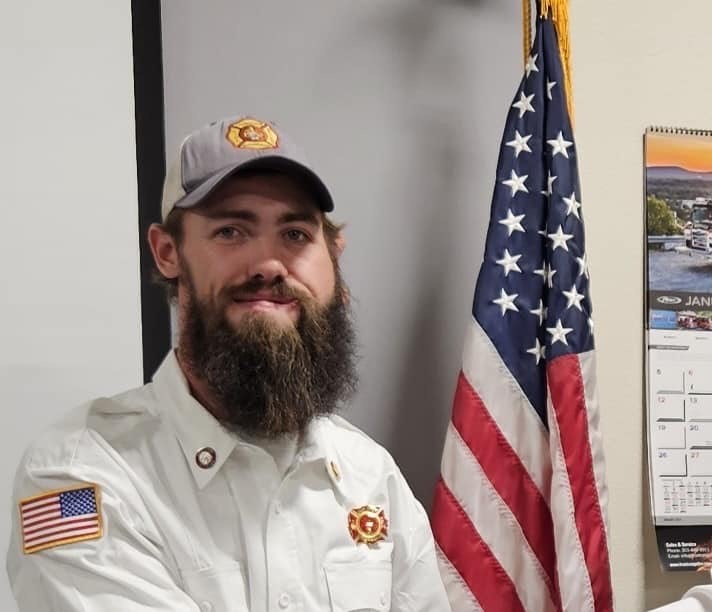 May contain: flag, captain, officer, person, adult, male, man, beard, face, head, clothing, and hat