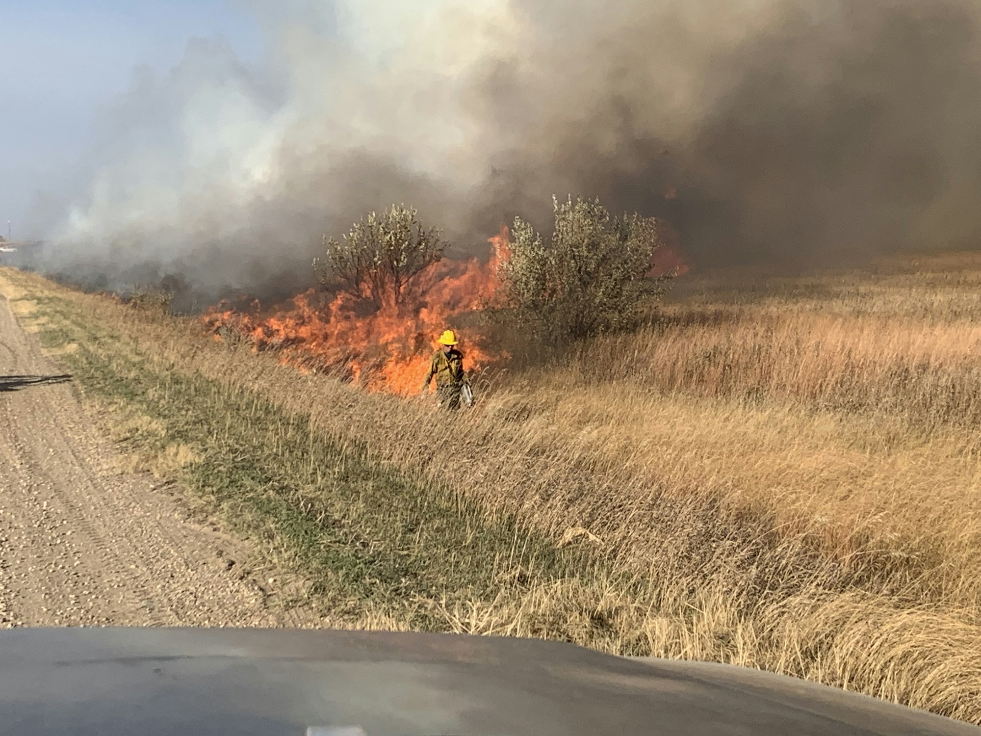 May contain: person, helmet, and fire