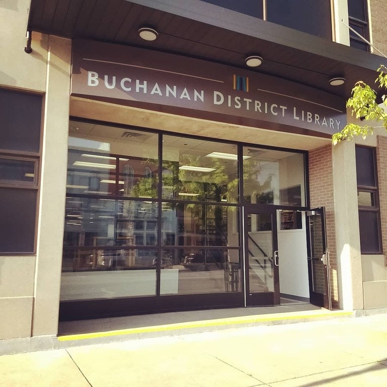 Entrance of Buchanan District Library, modern design, glass doors.