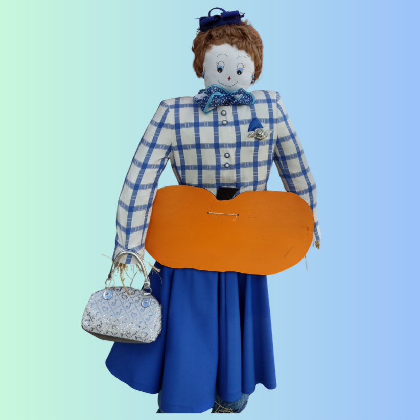 A scarecrow with a plaid top, blue skirt, bow tie, and holding a handbag against a gradient background.