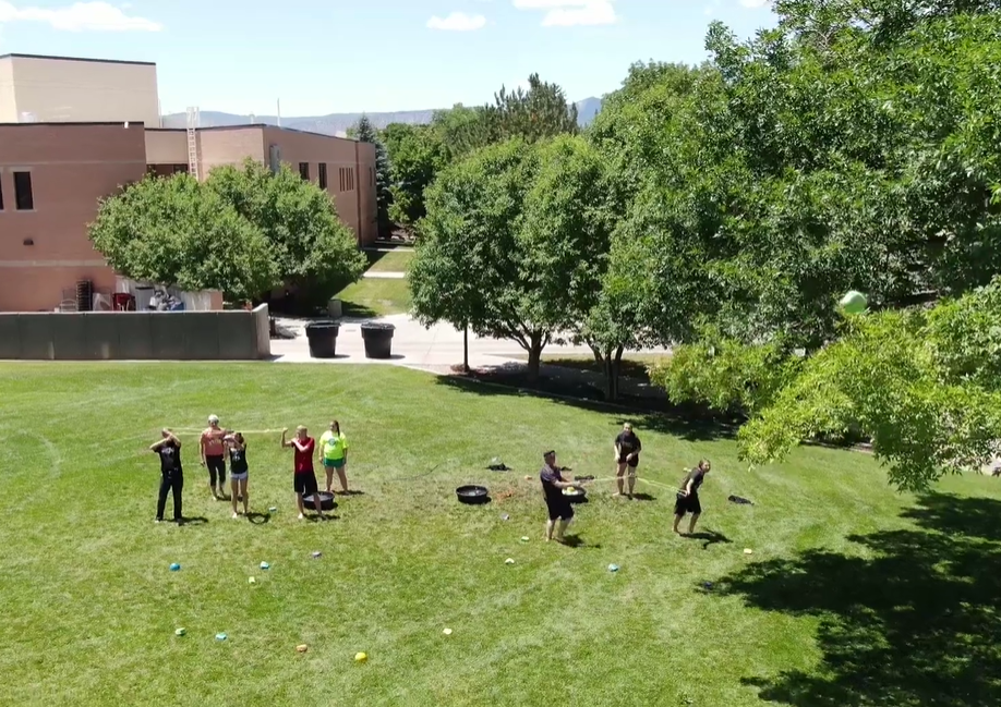 May contain: grass, plant, person, human, vegetation, campus, and outdoors