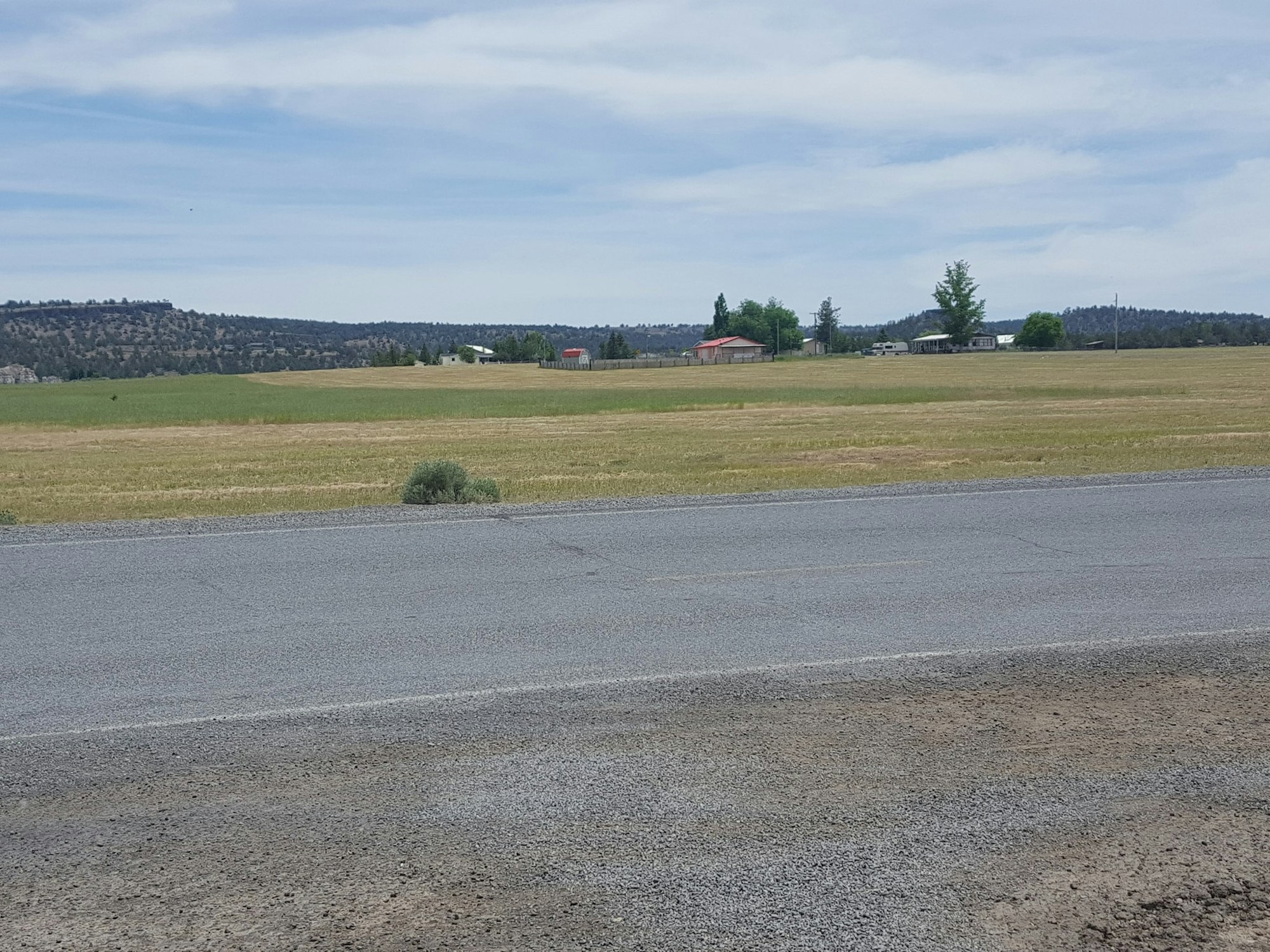 May contain: gravel, dirt road, road, asphalt, tarmac, and outdoors