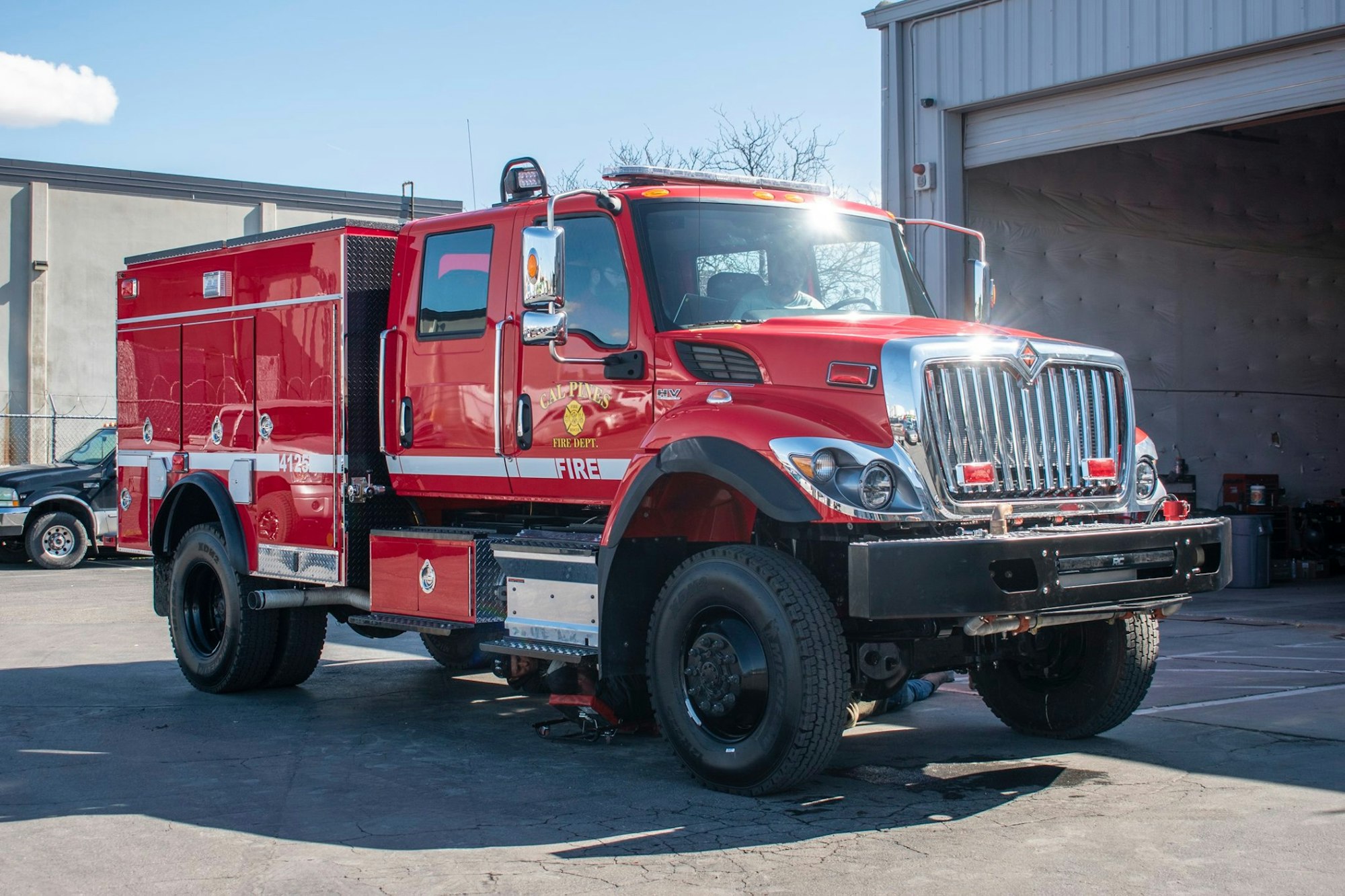 May contain: vehicle, truck, transportation, fire truck, human, and person