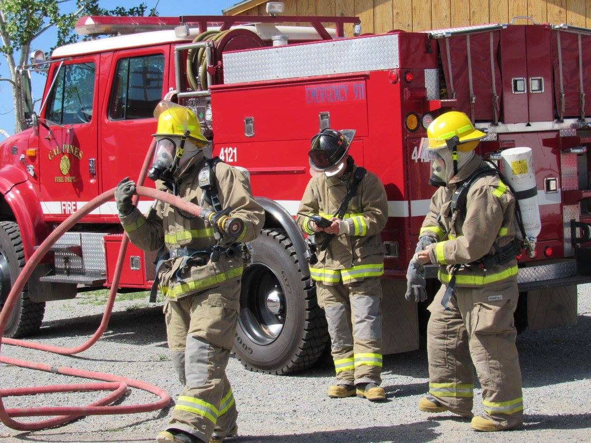 May contain: helmet, apparel, clothing, human, person, machine, wheel, truck, vehicle, transportation, and fireman