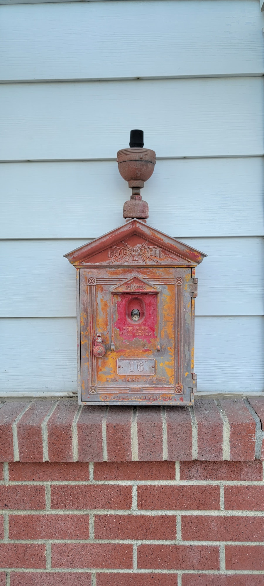 May contain: brick and mailbox