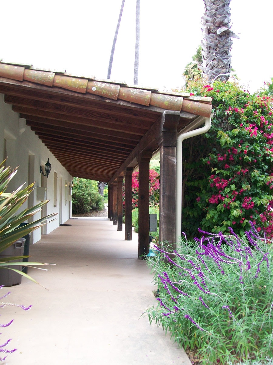 May contain: architecture, building, house, housing, porch, garden, nature, outdoors, arbour, patio, pergola, plant, villa, path, walkway, and purple