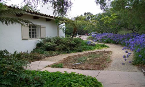 May contain: path, architecture, building, cottage, house, housing, villa, walkway, garden, nature, outdoors, plant, vegetation, backyard, yard, and tree
