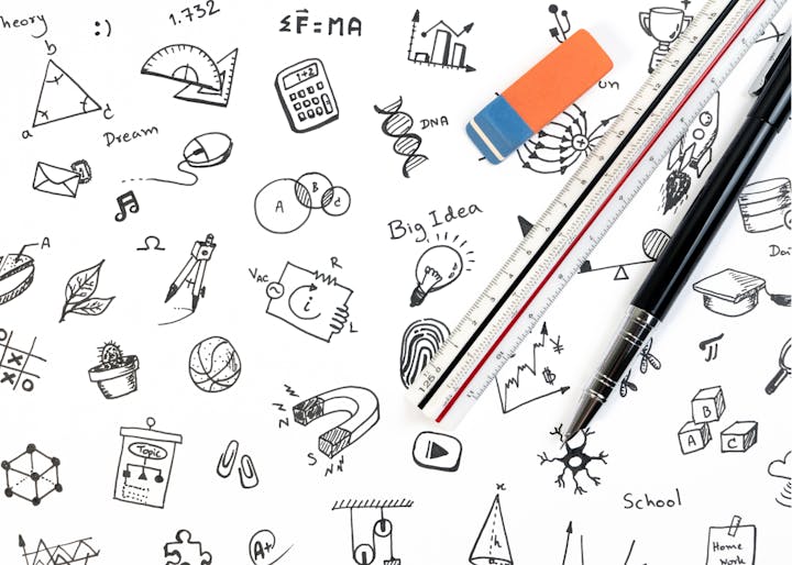A paper with doodles representing science and education concepts, with pencils, a ruler, and an eraser on top.