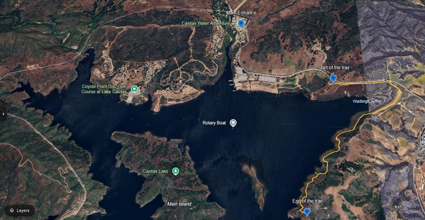 Satellite view of Casitas Lake with labeled features: trails, disc golf, water adventure, and boat areas.