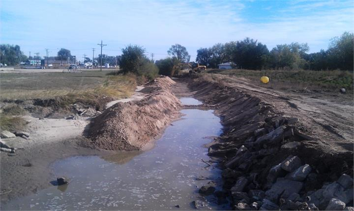 May contain: soil, ditch, outdoors, ball, sport, tennis, tennis ball, water, and nature