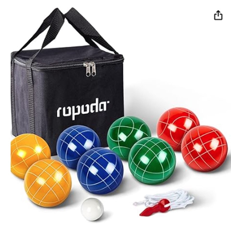 Bocce ball set with colorful balls, a white pallino, measuring rope, and black carrying bag.