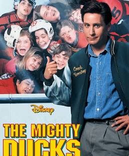 The image features the poster for "The Mighty Ducks," showcasing a youth ice hockey team and their coach.
