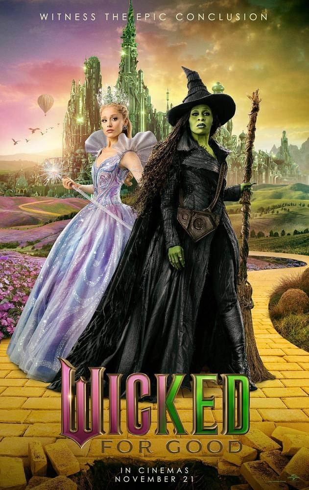 Two characters on a yellow brick road with a fantasy city backdrop. Text: "Wicked For Good" with a release date.