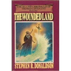 The image shows the book cover of "The Wounded Land" by Stephen R. Donaldson, part of "The Second Chronicles of Thomas Covenant."