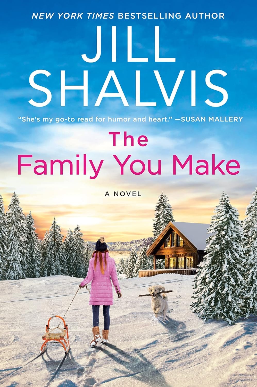 A woman in winter clothes, with a sled, walks toward a cabin in a snowy landscape, accompanied by a dog. Book: "The Family You Make."