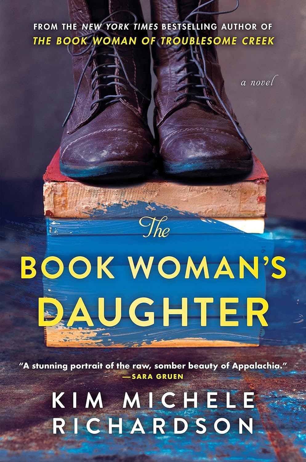 The image shows the book cover for "The Book Woman's Daughter" by Kim Michele Richardson, featuring boots and colorful text.